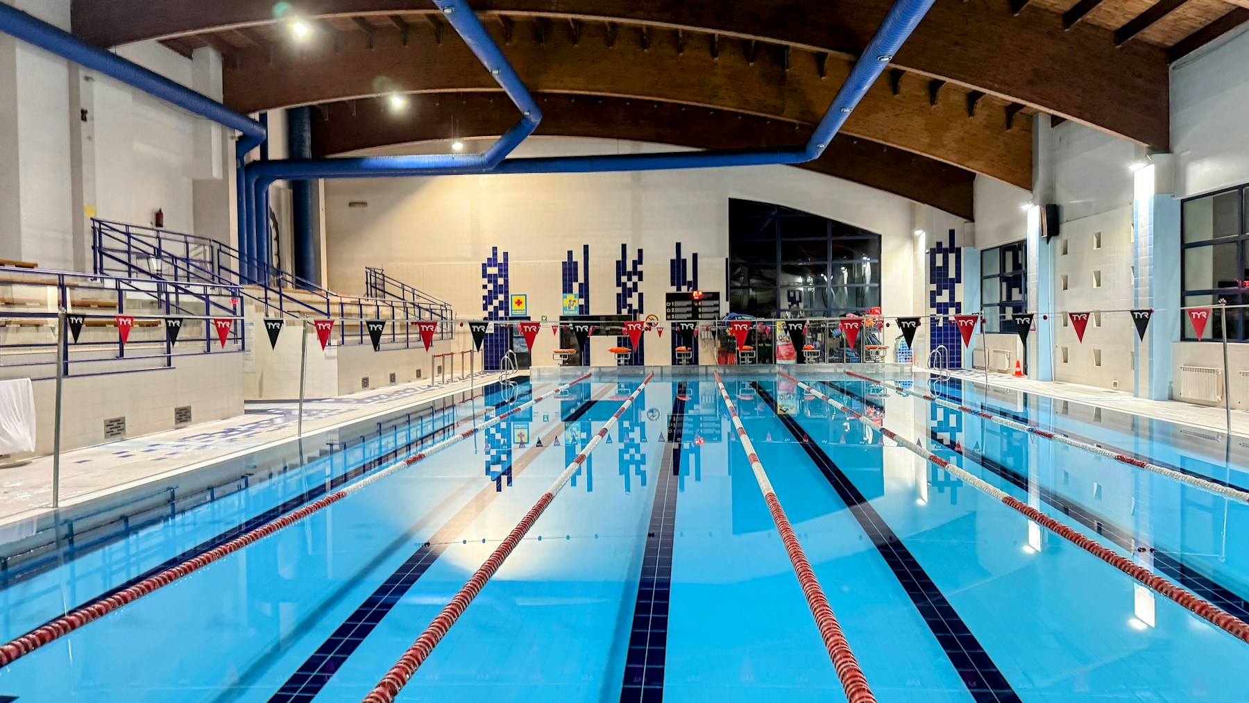 Illustrative indoor swimming pool with lane ropes