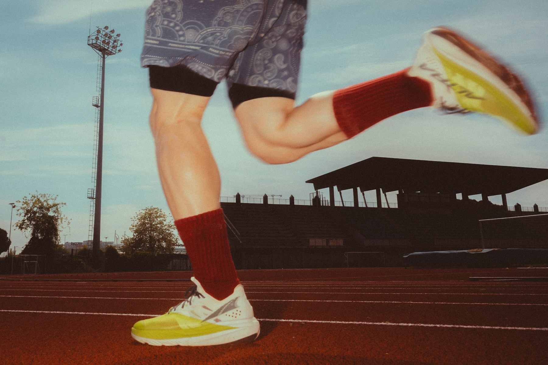 Illustrative view of runners' legs on a track